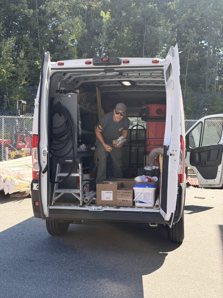 State Line work van stocked with tools and plumbing parts